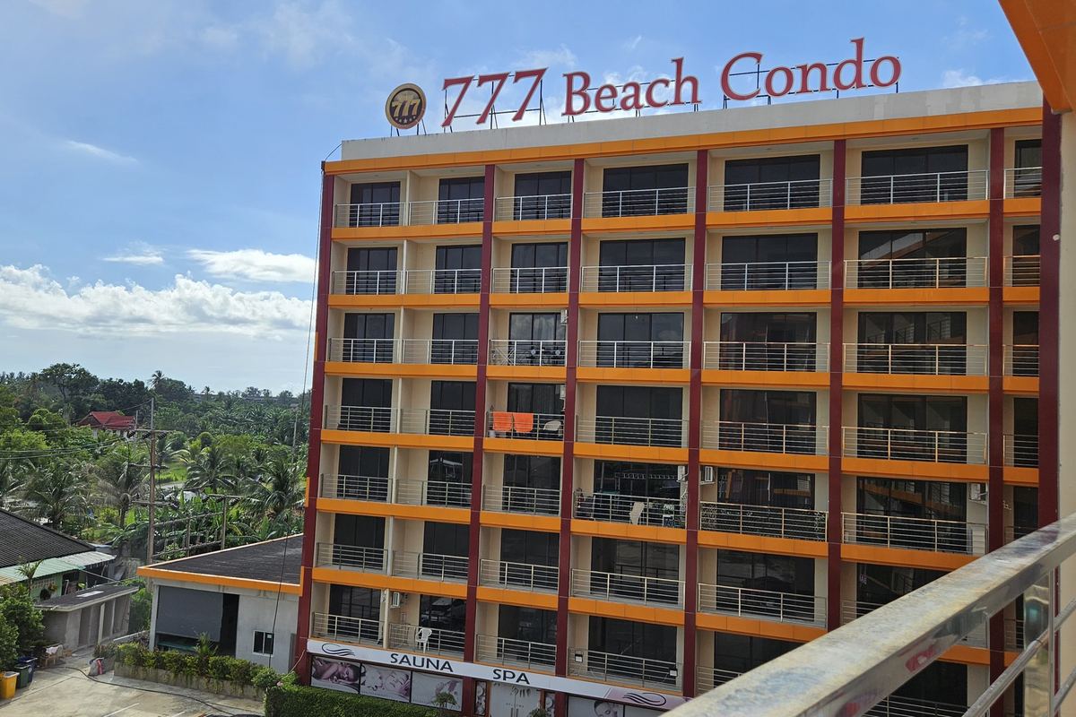 A building of 777 Beach Condo with its name on the roof